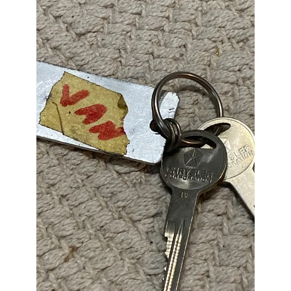Vintage Jim Clark Chrysler Plymouth Dodge VW Isuzu Key Fob Lawrence KS Metal Tag